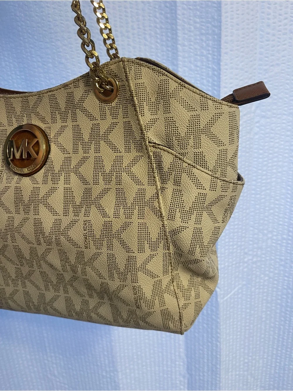 39. Rehab, Michael Kors purse.